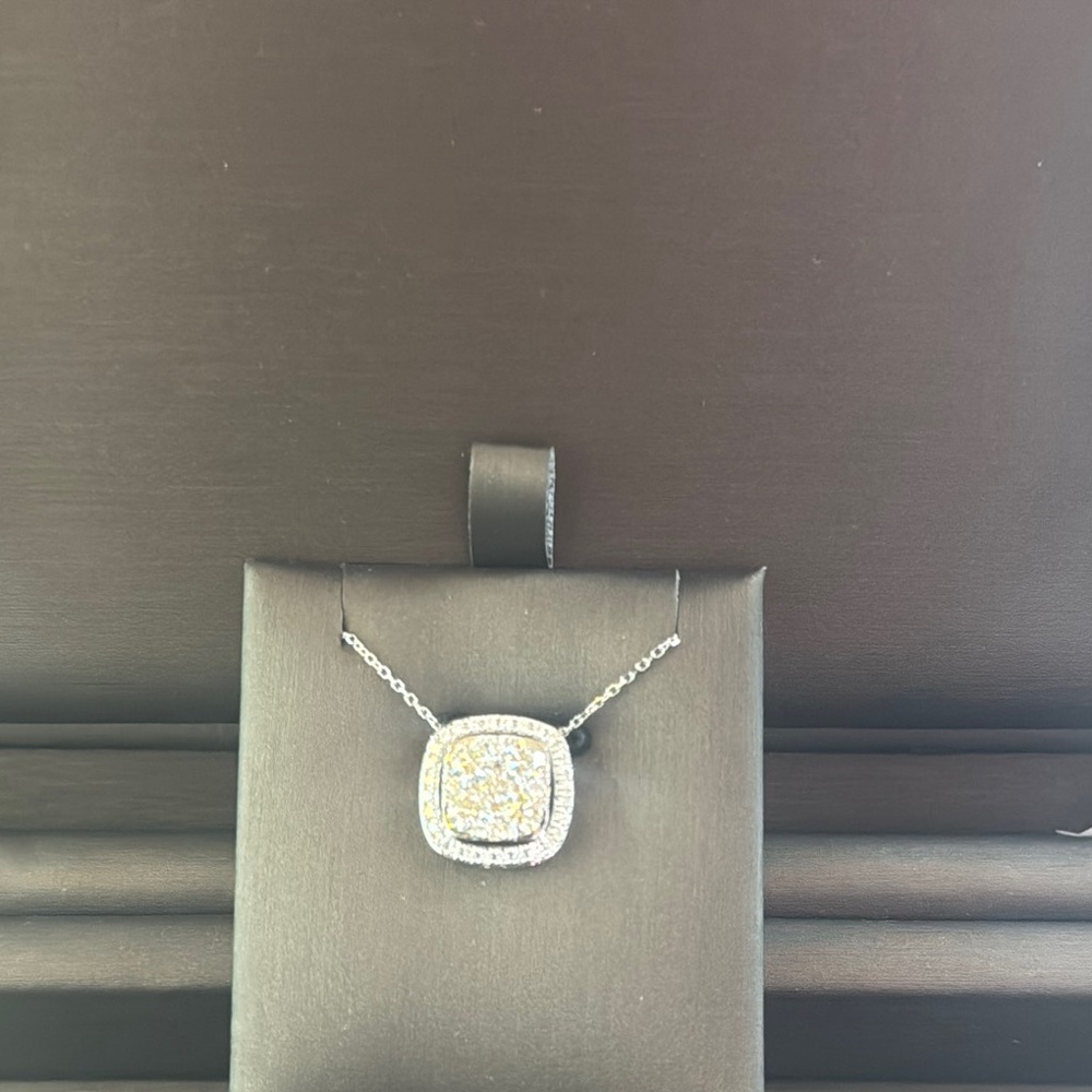 Sophisticated Silver and Gold Necklace with Sparkling Gemstone